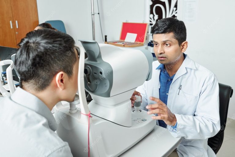 indian-ophthalmologist-examining-patient_274689-7746